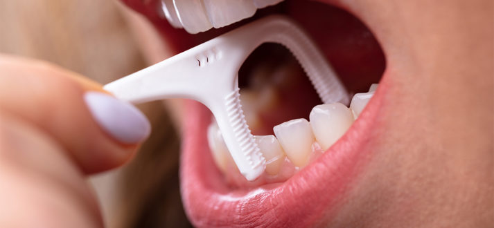 How To Improve Your Oral Health By Flossing | Partha Clinic